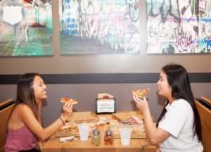 Friends eating pizza